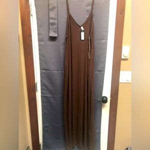 New with tags brown maxi dress with pockets.  Adjustable straps.